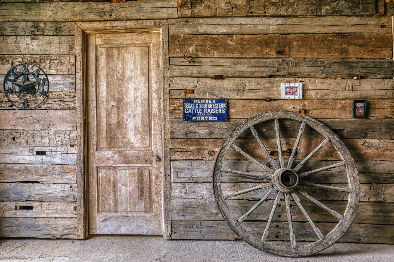 Rustic barn wall with Texas Cattle Raisers sign