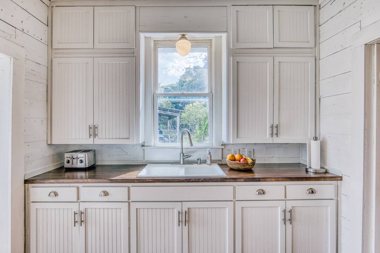 Kitchen cabinetry detail with farmhouse sink